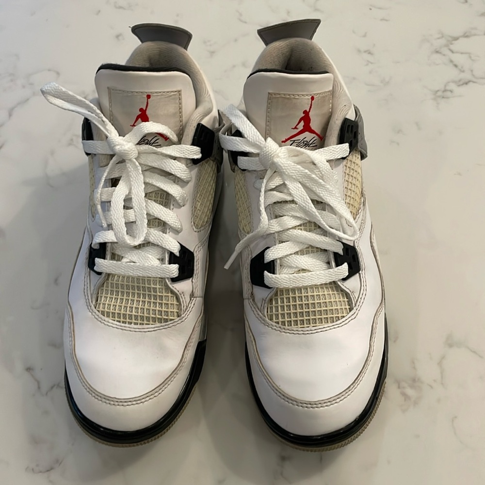 Gently used Nike Jordan 4 Retro in white cement.
